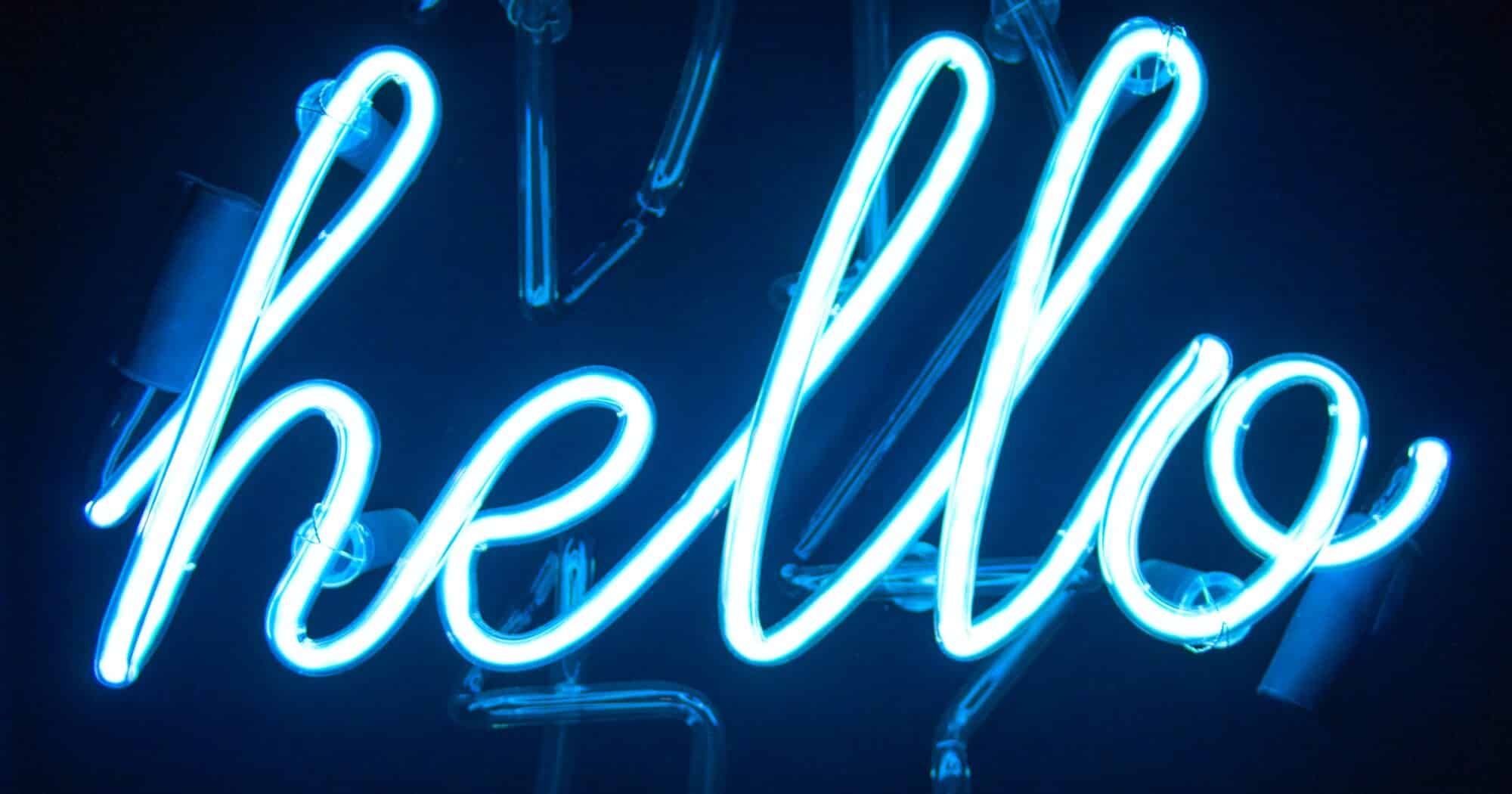 A blue neon sign that reads "Hello."