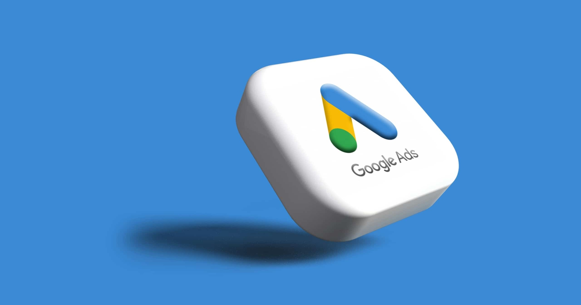 A 3D square button with the Google Ads logo and text Google Ads on a blue background, casting a shadow below—perfect for platforms focused on digital marketing or tracking consumer spending trends.
